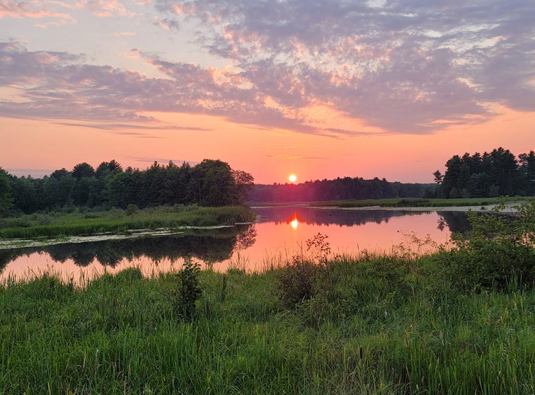 Photo of a sunset on the water.