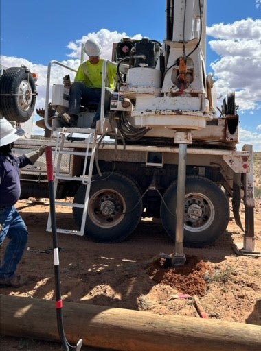 CWEC lineman Josh Wick operates a pressure digger. Most of the pole holes required a pressure digger because of rock in the area.